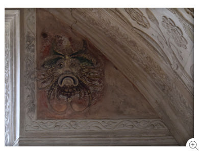 13/18 One of a pair of rare plaster, painted masks in Chastleton's Long Gallery